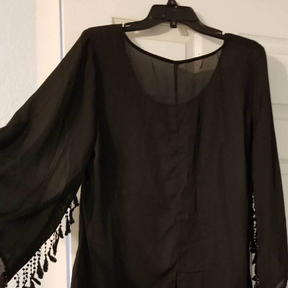 Sheer blouse with tassle